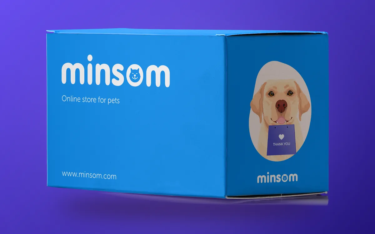 Blue Minsom box with a Labrador and a Thank you bag on a purple background