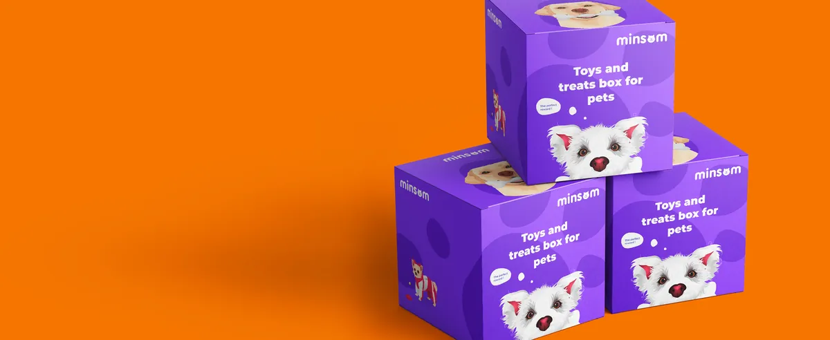 Purple Minsom Toys and treats gift boxes with a terrier on an orange background