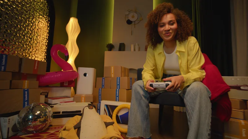 Looknet commercial still: a young woman bought furniture on Looknet